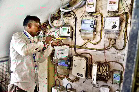 EB line inspector seen replacing defective EB meter at Ambattur. (Photo | P Ravikumar)
