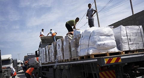 Trucks with humanitarian aid for the 'Gaza Strip enter from Egypt in Rafah on Saturday, Oct. 21, 2023.(Photo | AP)