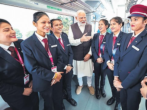 PM Modi interacts with metro staff at Namo Bharat train in Sahibabad, UP | pti