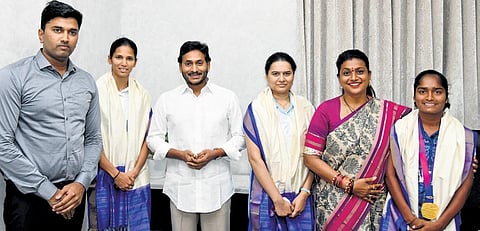Sports persons who won medals in Asian games, Koneru Hampi, B Anusha and Y Jyothi, met CM YS Jagan Mohan Reddy at his camp office in Tadepalli on Friday | Express