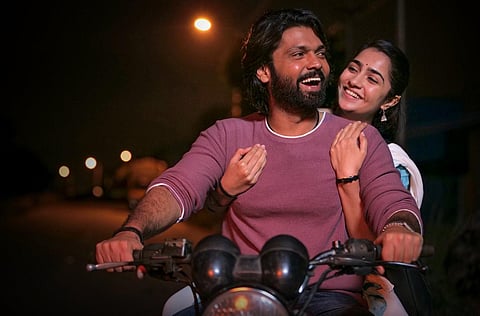 A still from the film 'Sapta Sagaradaache Ello - Side A', directed by Hemanth M Rao and featuring Rakshith Shetty, Rukmini Vasanth, and Chaitra Achar in the lead roles.