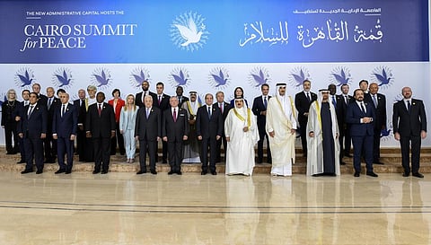 Participants of the International Peace Summit pose for a group picture at the New Administrative Capital (Photo | AP)