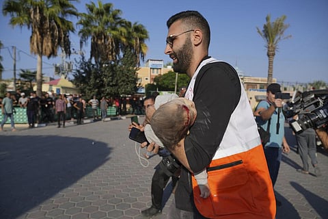 FILE: Palestinians wounded in Israeli air strikes on Gaza Strip are brought to al-Aqsa hospital in Deir el-Balah City, Gaza Strip, Saturday, Oct. 14, 2023. (AP)