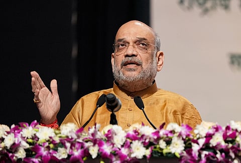 Union Home Minister and Minister of Cooperation Amit Shah addresses during the National Symposium on Cooperative Exports organised by National Cooperative Exports Limited in New Delhi. (Photo | PTI)
