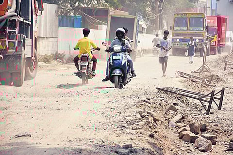 Motorists negotiating a damaged road in Perungudi | Ashwin Prasath