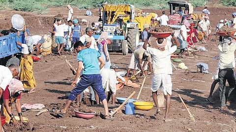 A file photo of labourers working on an infra project under MGNREGA