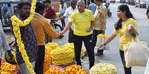 Rush at the market for festival purchases ahead of ayudha puja and Vijayadashami in Mysuru on Sunday. (Photo | Udayashankar S)