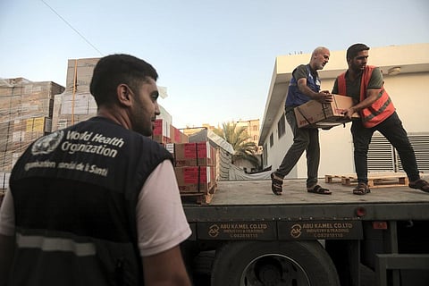 Palestinians unload boxes of medicine from a truck arrived at Nasser Medical Complex, as part of the aid batch that entered in to the Gaza strip from Rafah crossing Sunday. (Photo | AP)