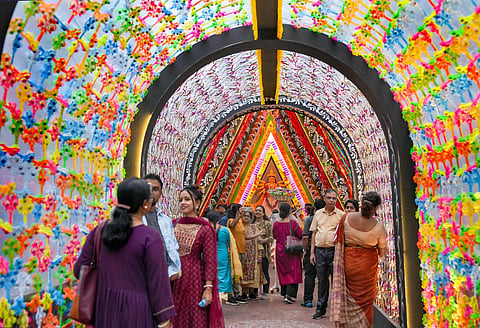 Devotees visit a community puja pandal on 'Navami' of the Durga Puja festival, in Kolkata, on Oct 23, 2023. (PTI)