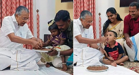 Chief Minister Pinarayi Vijayan initiates a child into the world of letters at the Vidyarambham ceremony held at Cliff House on Tuesday. (Photo | Facebook)