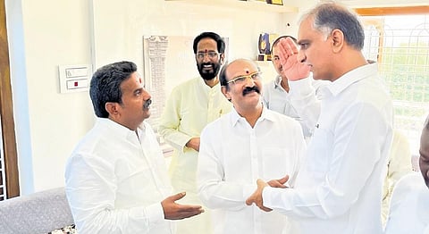 Finance Minister T Harish Rao tries to convince DCCB chairman Patnam Manikyam not to leave BRS during his visit to Fasalwadi village on Tuesday