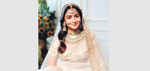 Alia Bhatt in her wedding saree (left)at the National Awards recently (right)