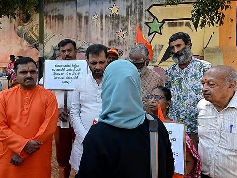 Members of Hindu organisations protest against the state government for going against the education policy on uniforms and approving hijab in schools in Bengaluru. (Photo | Shashidhar Byrappa)