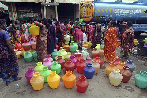 Representational Image: Women wait to fill vessels filled with drinking water from a water tanker in Chennai (Photo | AP)