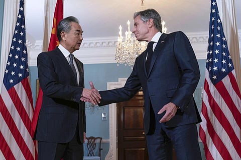 Secretary of State Antony Blinken shake hands with China's Foreign Minister Wang Yi after a bilateral meeting at the State Department in Washington, Oct 26, 2023. (Photo | AP)
