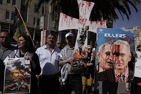 Palestinians rally against the Israeli bombardment of the Gaza Strip in the West Bank city of Nablus on Thursday, October 26, 2023. (Photo | AP)