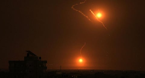 Flares fired by the Israeli army light up the sky east of Khan Yunis on the southern Gaza Strip on October 27, 2023 .(Photo | AFP)