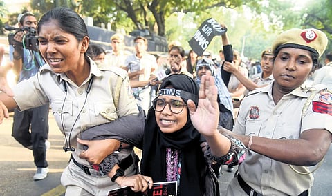 Security personnel detain protestors for gathering without permission at Jantar Mantar on Friday | Parveen Negi