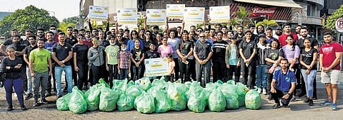 Volunteers take part in plogging initiative where they collect litter while jogging