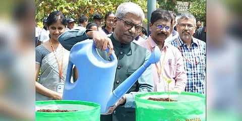 P Shyamaraju, Chancellor, REVA University, plants a sapling (Photo | Twitter)