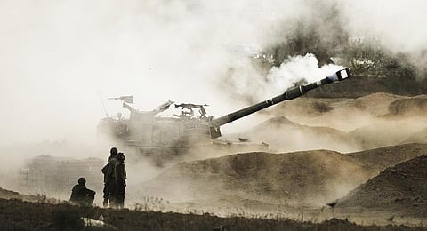An Israeli mobile artillery unit fires a shell .(Photo | AP)