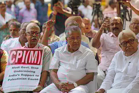 Kerala CM and CPI(M) leader Pinarayi Vijayan with party leader Biman Bose during a demonstration over Israel-Palestine conflict at party office, in New Delhi.