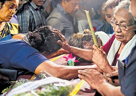 Ponnamma, mother of Kumari who was killed in the bomb blast in Kalamassery, consoles her daughter Prabha and relative Suma when Kumari’s body was kept on the premises of her rented house in Kaliyar on
