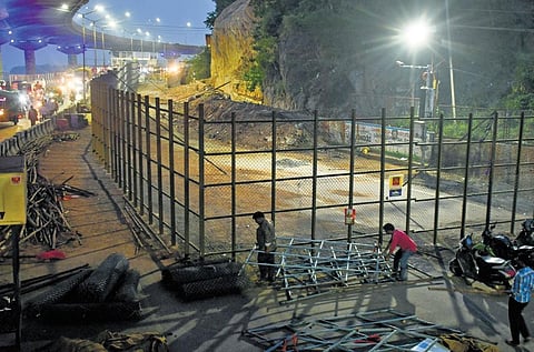 SDMSD authorities setting up barricades to carry out the repair works where landslide occurred in the last month I Prasant Madugula
