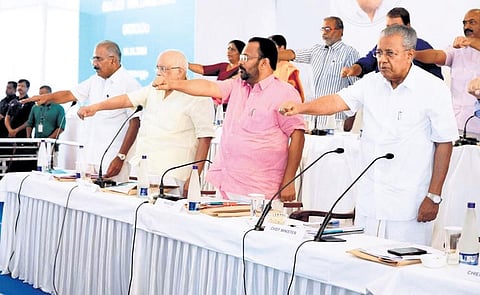 Chief Minister Pinarayi Vijayan, Forest Minister A K Saseendran, Power Minister K Krishnankutty and Revenue Minister K Rajan taking pledge at the sectoral review meeting in Kochi on Tuesday