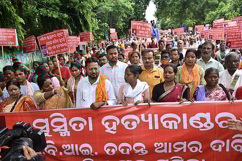 Agitating tribals demanding CBI probe into the two deaths on Tuesday. (Photo | Express)