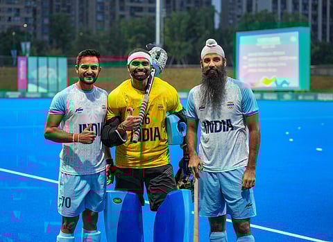 India's Sanjay, PR Sreejesh and Jarmanpreet Singh pose for photos after winning the men's hockey semifinal against Korea (Photo | PTI)