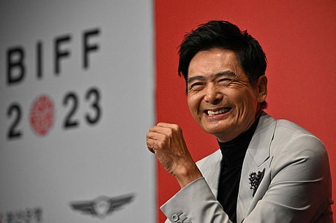Hong Kong actor Chow Yun Fat laughs during a press conference at the 28th Busan International Film Festival (BIFF) in Busan on October 5, 2023. (AFP)