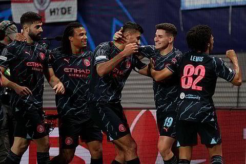 Manchester City's Julian Alvarez celebrates with his teammates after scoring his side's second goal. (Photo | AP)