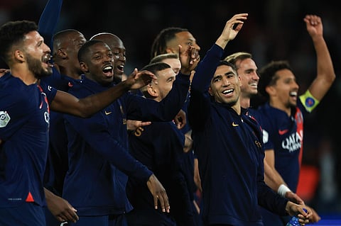 PSG players celebrate their victory after the French League One football match between Paris Saint Germain and Olympique de Marseille at Parc des Princes stadium. (Photo | AP)