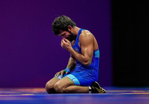 Bajrang Punia reacts after losing to Japan's Kaiki Yamaguchi in the men's freestyle 65kg category wrestling match for the bronze medal at the Asian Games (Photo | PTI)