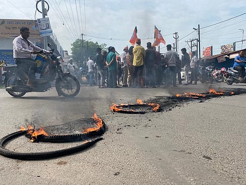 Protesters burn tyres on roads to stop vehicular movement. (Photo | Express)
