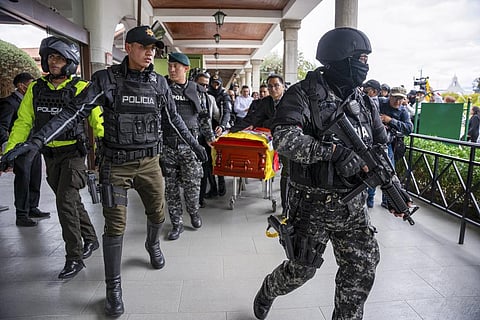 Police escort the coffin carrying the remains of slain presidential candidate Fernando Villavicencio at the Camposanto Monteolivo cemetery, in Quito, Ecuador, Aug. 11, 2023. (Photo | AP)