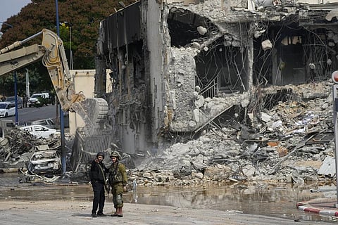 A digger removes the rubble from the police station that was overrun by Hamas militants on Saturday, in Sderot, Israel, Sunday, Oct.8, 2023. (Photo | AP)