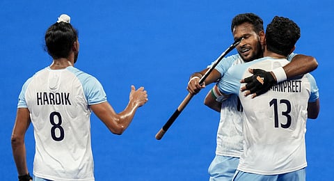 India's captain Harmanpreet Singh, Hardik Singh and Amit Rohidas celebrate after winning the Men's Hockey Final at Asian Games.(Photo | PTI)