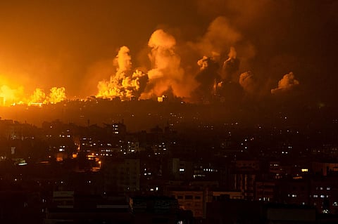 Fire and smoke rise following an Israeli airstrike, in Gaza City on Sunday, October 8, 2023. (Photo | AP)