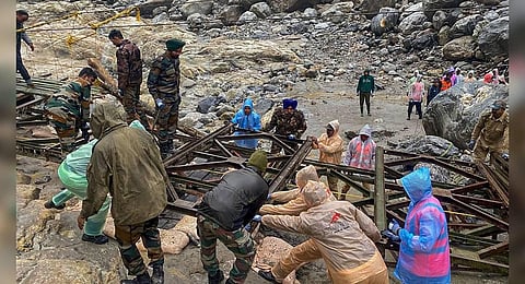 BRO personnel of Project Swastik rescue tourists from flood-affected Lachen Valley, at Chungthang in Sikkim | PTI