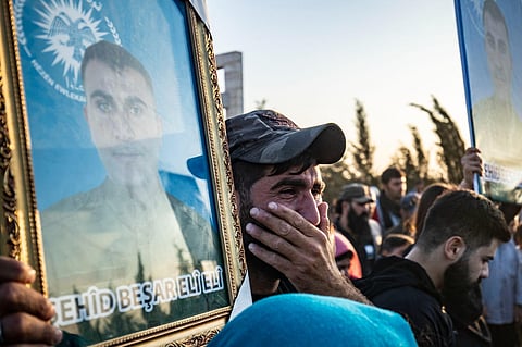 A man reacts during the funeral of members of the Kurdish Asayish security forces, killed a day earlier in a Turkish drone strike, in the town of Amuda on October 7, 2023. (Photo | AFP)