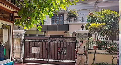 A police official stands guard at the residence of AAP MLA Kulwant Singh, where the ED conducted searches in connection with a drug-linked money laundering case, in Mohali onOct. 31, 2023. (PTI)