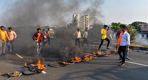 Maratha Kranti Morcha activists burn tyres and other inflamable items during a protest on Pune-Solapur Highway to press for Maratha reservation. (Photo | PTI)