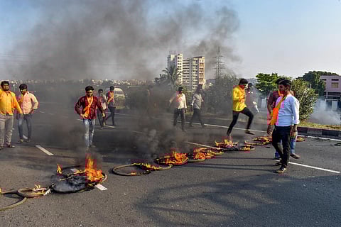 Maratha Kranti Morcha activists burn tyres and other inflamable items during a protest on Pune-Solapur Highway to press for Maratha reservation, in Solapur, Tuesday, Oct. 31, 2023. (PTI)