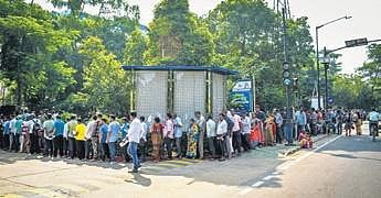 People stand in a long queue in front of RBI building in Bhubaneswar to exchange `2,000 currency notes | Express