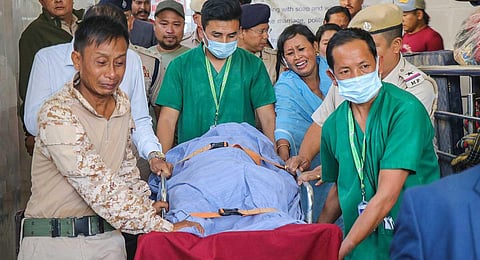 Mortal remains of a Manipur Police officer, Chingtham Anand, being shifted to JNIMS mortuary on Oct. 31, 2023. (PTI)