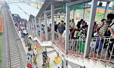 Huge crowd at Tambaram railway station after several trains were cancelled due to engineering work at St Thomas Mount on Tuesday. (Photo | Allen Egenuse J, EPS)