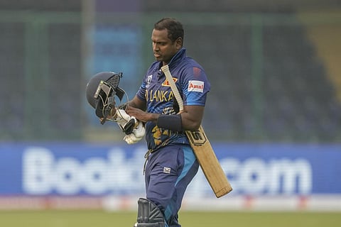 Sri Lanka's Angelo Mathews walks off the field after he was declared timed out during the ICC Men's Cricket World Cup match against Bangladesh in New Delhi, Nov. 6, 2023. (Photo | AP)