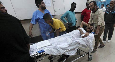 Palestinians wounded in the Israeli bombardment of the Gaza Strip are brought to a treatment room of al Aqsa Hospital.(Photo | AP)